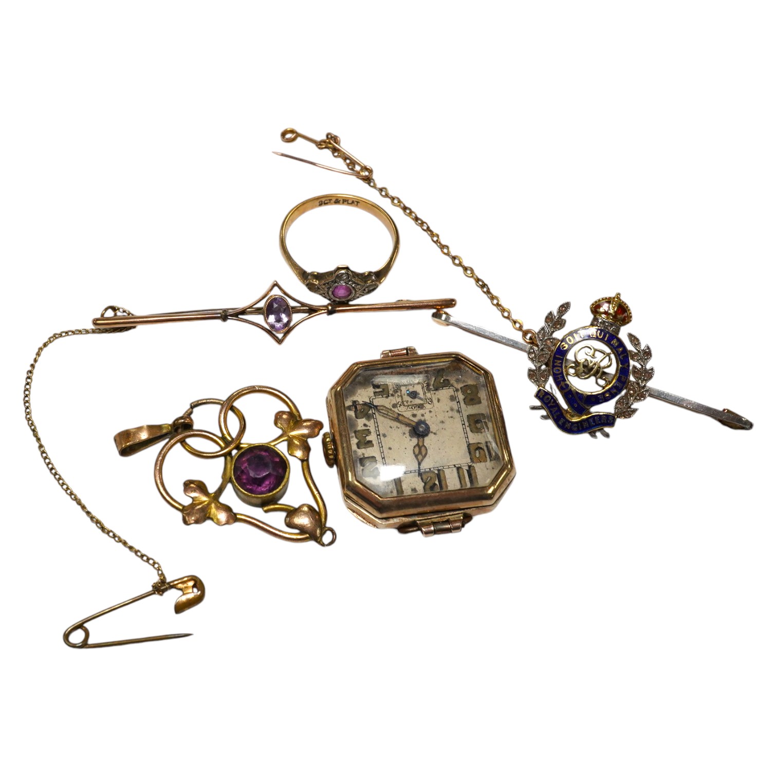 An enamelled 15ct gold Royal Engineer's sweethearts brooch with diamond chips, 5cm, gross 5.8 grams, a gold wrist watch, a 9ct gold and amethyst bar brooch, 2.1 grams, a ruby and diamond chip set 9ct gold dress ring, gro